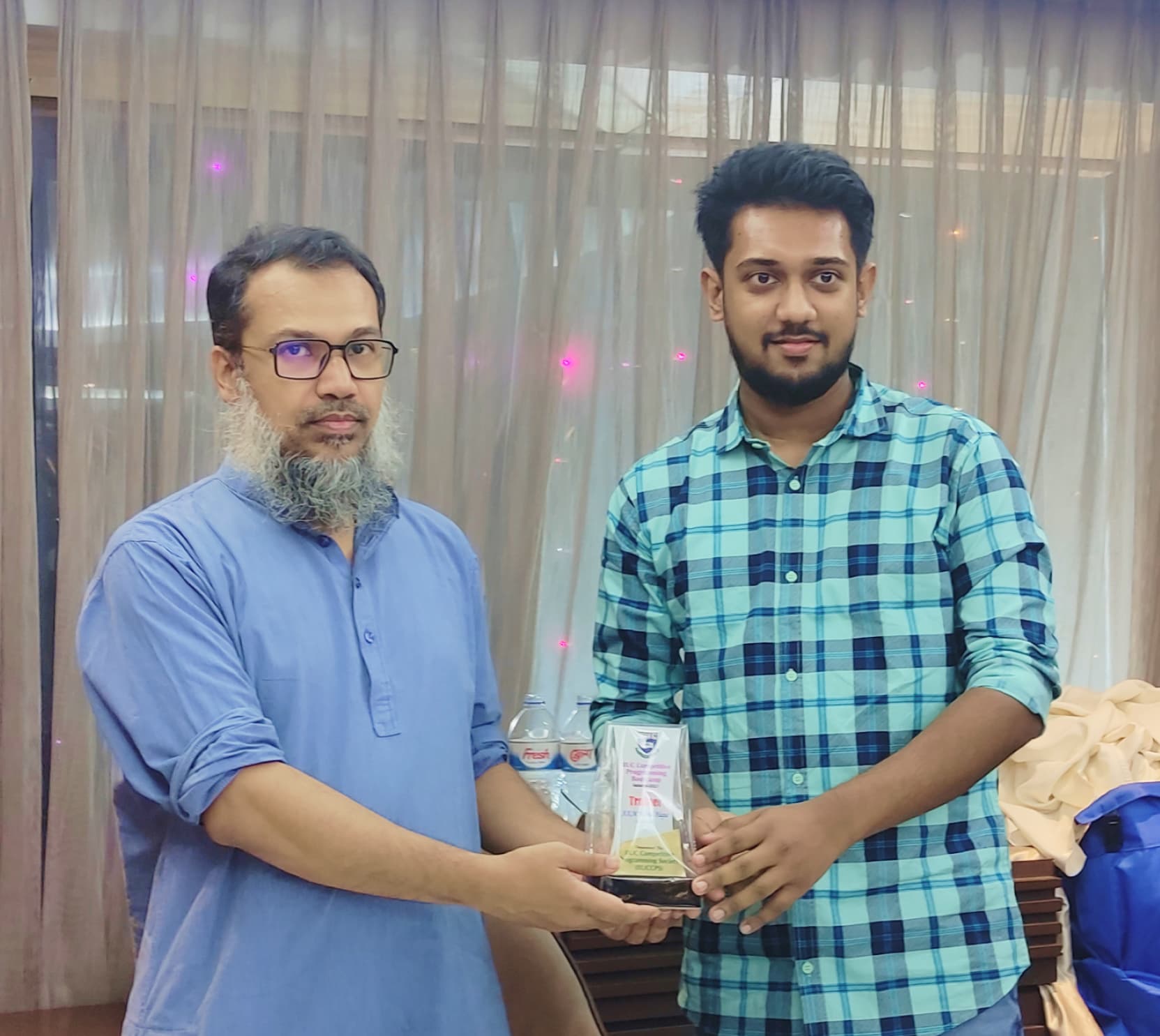 Receiving Crest from Tanveer Ahsan, Ex-Chairman, Dept. of CSE, IIUC